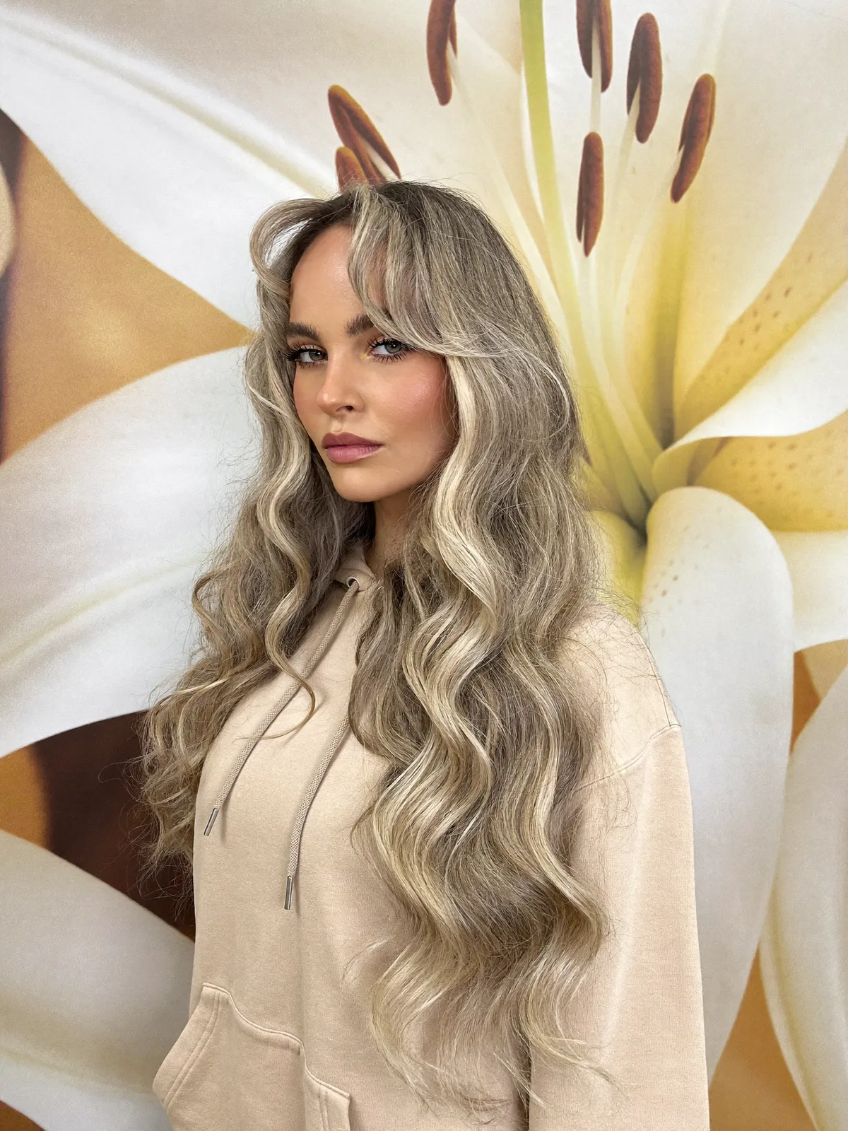 Long Voluminous Ash Blonde Layers with Natural Highlights